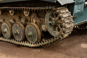 Detail of an German tank from World War II. Close-up.  Background.   Dirty tank track after crossing a field.