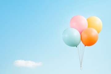 pastel balloons against blue sky