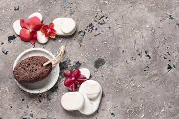 Spa stones, pumice and orchid flowers on grunge background