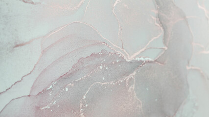Exploring the delicate textures and colors of alcohol ink abstract art on a smooth surface