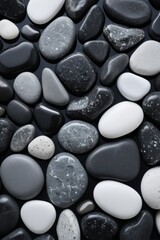 a close up of a pile of black and white rocks