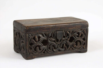 Intricate carved wooden box on white
