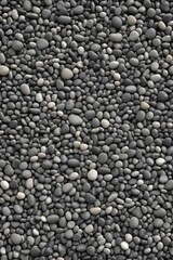 a close up of a pile of black and white rocks