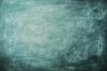 Obraz premium Teal chalkboard texture background; erased writing; classroom; education