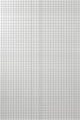 a close up of a white and black checkered paper with a red stop sign