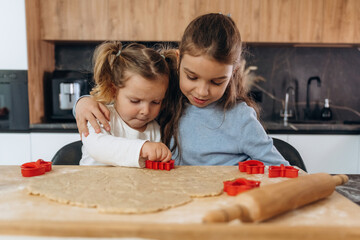 Two little girls are preparing bakery at home