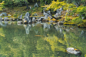 Beautiful scenic Japanese garden with a large pond. Sogenchi Garden on the grounds of Tenryu-ji Temple located in Arashiyama, Kyoto.
