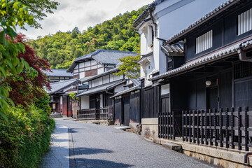 Empty street with traditional houses in Arashiyama, Japan.
