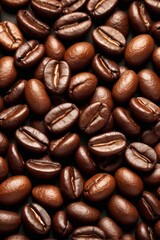 Fototapeta premium a close up of a pile of coffee beans with a brown background