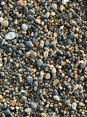 Small stones are part of the beach sand