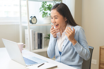 Excited with computer, happy celebrating success asian young woman, girl amazed looking good news at pc, laptop on desk at home office, get win online lottery, student winner celebrating achievement.