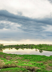 Cloudy sky with a lake in the background