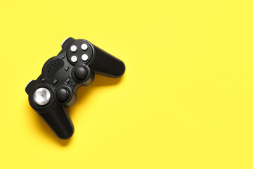 Modern game pad on yellow background