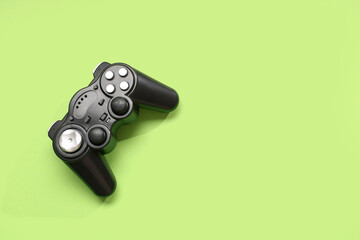 Modern game pad on green background