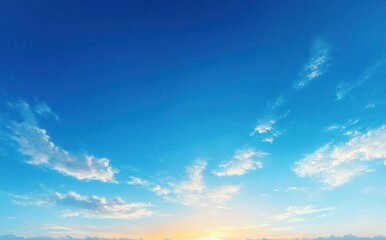 Obraz premium serene blue sky at twilight with soft clouds and warm light