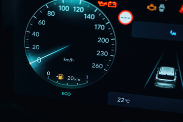 Dark and blue colors. Detailed close up view of speedometer, front panel