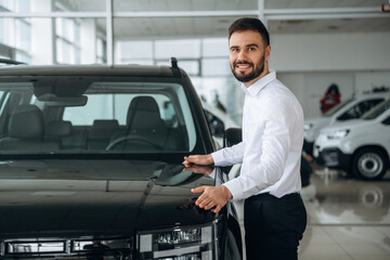 Dealership worker is near the car
