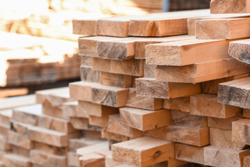 Stacked wooden planks at sawmill, closeup