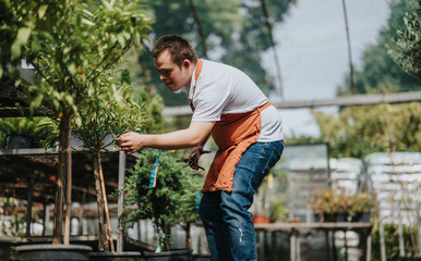 A dedicated young gardener with down syndrome carefully tending to plants in a greenhouse setting....