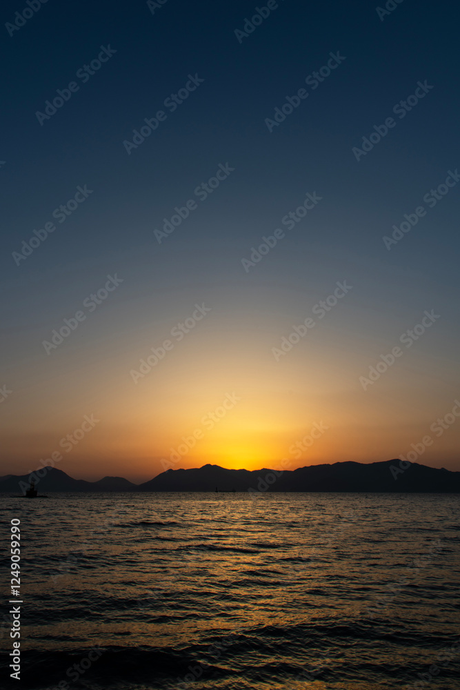 Wall mural tranquil seascape after sunset