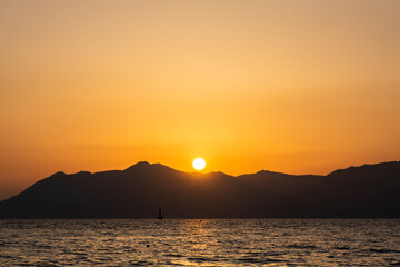 View of the sunset over the sea and island