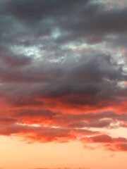 Calm Sunset Clouds In Reds and Blues Natural Background Skyscape