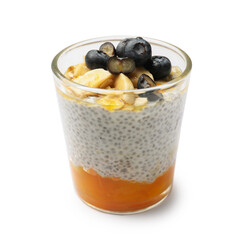 Delicious chia pudding with blueberries, banana and oatmeal in glass isolated on white
