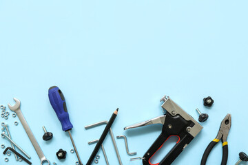 Carpenter's tools on blue background