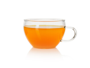 Aromatic turmeric tea in glass cup isolated on white