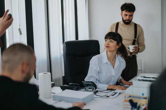 Professionals working together in an office setting, showcasing collaboration, productivity, and teamwork in a business environment.