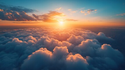Aerial view of sunset above fluffy clouds.