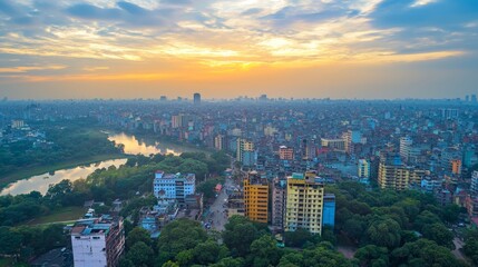 Fototapeta premium Panoramic sunrise view of a sprawling city with a river winding through, showcasing dense urban development and surrounding greenery.