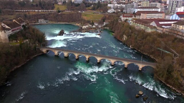 Rheinbruecke bei Laufen Eisenbahn-Bogenbruecke Luftaufnahme im Fruehling, Schweiz, Laufen-Uhwiesen, Neuhausen am Rheinfall. Rheinfallbahn. Aerial view of single-track railway bridge Rheinbrucke. 
