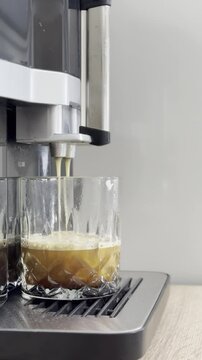 Making espresso with a coffee machine at home
