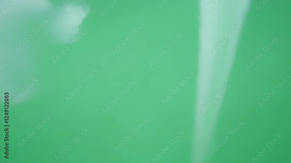 Poster floating trails of vapor appear to dissolve into the background creating an illusion of depth. green