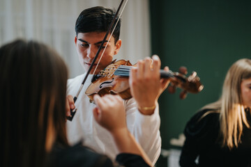 A young musician demonstrating skill while playing the violin, with attentive onlookers enjoying the music. © qunica.com