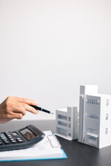 Finance bank tax expense accounting budget money businessman home for Business expense analysis saving use Financial calculate accountant close up calculator with graph chart hand write office desk