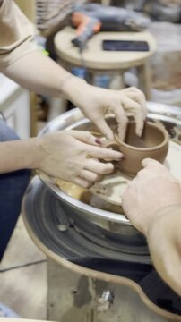 Mastering pottery techniques at a clay workshop in spring