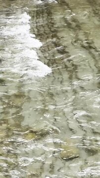 Flowing water over rocks in a serene natural setting