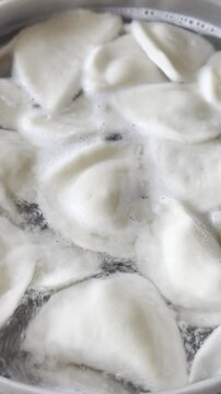 Dumplings boiling in water for a hearty meal