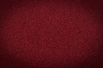 Burgundy paper with vignette a background or texture