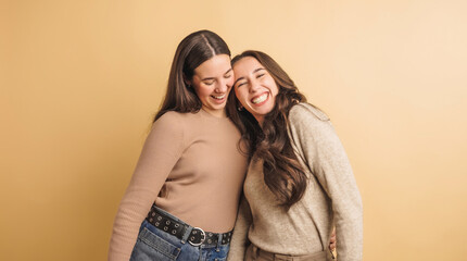 Two friends laughing together in joyful moment