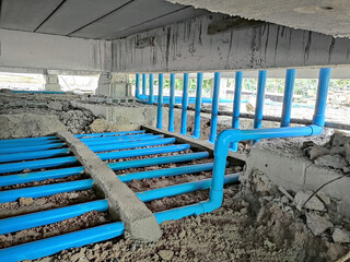 Installation of water pipes in the building. Water pipe system under the building.Installing water...