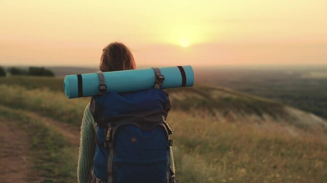 girl with backpack traveling at sunset, hiking person, lidi adventure nature, discovering new paths, nature's evening charm., capturing twilight moments, embracing the evening glow, embracing the