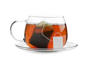 Tea bag in glass cup with hot drink isolated on white