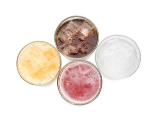 Soda water of different flavors with ice cubes in glasses isolated on white, top view