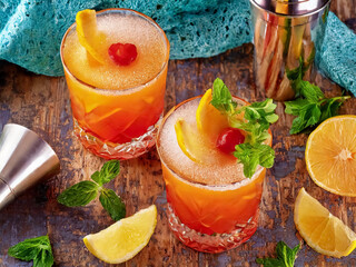 Orange cocktail on wooden underground