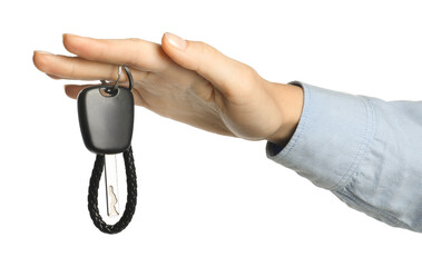 Woman with car key and keychain on white background, closeup