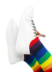 Woman wearing socks in LGBT colors on white background, closeup