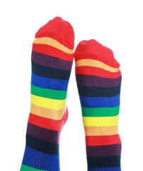 Woman wearing socks in LGBT colors on white background, closeup
